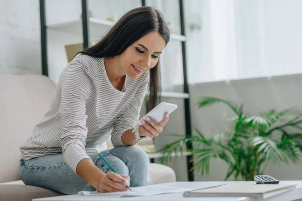 Woman smiling working at home