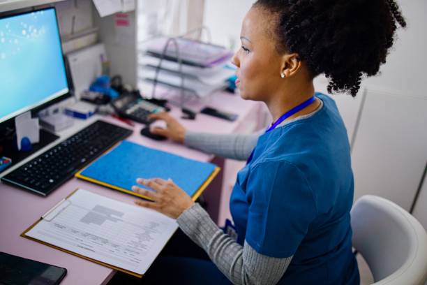 Nurse working at a computer 