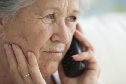 Renal patient on phone with contacts.